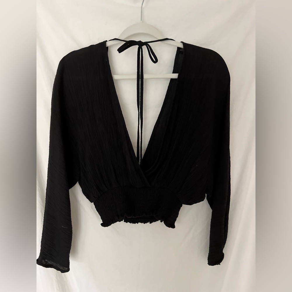 Black top, tie back detail